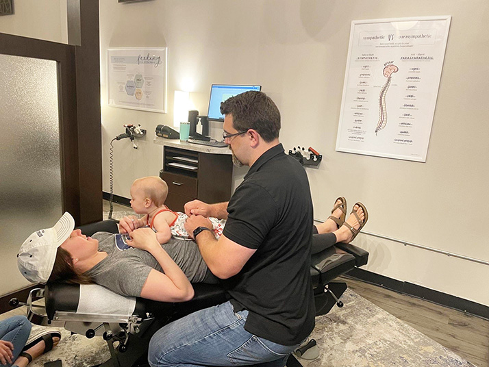 Chiropractor Berkley MI Nick Novakoski Adjusting Mom and Baby Chiropractor Berkley MI Nick Novakoski Adjusting Mom and Baby